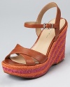 A striped fuchsia and tangerine jute wedge add color to rich cinnamon-hued leather. From Via Spiga.