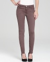 Tailored in a sleek, skinny silhouette, these J Brand jeans are fashioned in a soft, gray hue that works as a neutral.