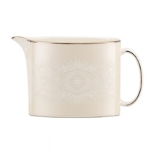 Laced with vintage elegance, the Chapel Hill creamer features a modern silhouette and prim doily pattern with platinum trim. Fine bone china from kate spade new york ensures a head-turning table setting for dinner parties, holidays and more.