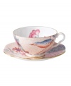 Delight in the tradition of English tea with the Cuckoo teacup and saucer set, featuring Wedgwood bone china adorned with gold bands, fanciful birds and vintage blooms. With scalloped detail.