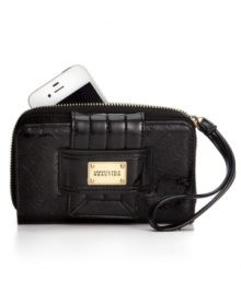 Dial up your fab factor with this Kenneth Cole Reaction wristlet that offers a posh place to stash your phone, cash, cards and ID.  Dressed in a luxe logo-embossed pattern and golden hardware, it's the perfect companion for any outing.