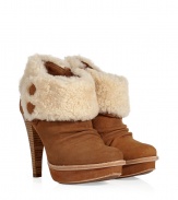 An edgy iteration of the iconic UGG boot, the Georgette guarantees to keep you warm in high style - Round toe, platform, crease-detailed front, shearling cuff with button details, chunky stacked leather high heel, inside zip closure - Ankle height - Pair with skinny jeans, an oversized cashmere sweater, and a down jacket or wool cape