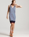 Striped on one side, solid on the other--this reversible Jean Paul Gaultier dress is the stylish solution to your lightweight packing dilemma. Nautical chic for your warm-weather getaway, the look is complete with punchy espadrilles.