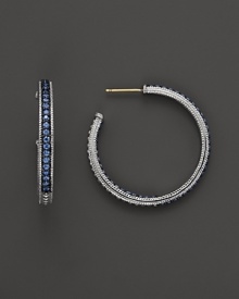 Sparkling sapphires detail a classic pair of sterling silver hoop earrings from Judith Ripka.