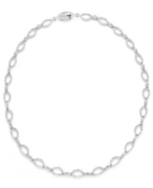 Shape up with a little shimmer. Eliot Danori's intricate oval link necklace glistens with the addition of round-cut crystals. Set in silver tone mixed metal. Approximate length: 16 inches.