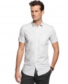 A simple staple gets a modern upgrade with this small collared short-sleeved shirt from Calvin Klein.