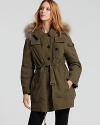 A fur-trim hood lends opulence to this military-inspired raincoat for a trend-right addition to the new season.