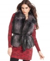 Get vested. This winter will feel balmy with this cozy, faux fur vest from Surell. Front zip closure and chic leather belt keep the cold from coming in, while side pockets offer an oasis of warmth for chilly hands.