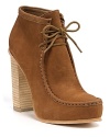 Earthy wooden heels raise these rugged leather chukkas into high style territory. By Dolce Vita.