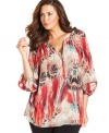 Be casually chic in Calvin Klein's three-quarter-sleeve plus size peasant top, featuring a relaxed fit.