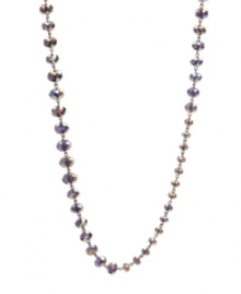 Lovely in lilac. Pale purple-hued faceted glass accents in small, medium and large shapes adorn this Kenneth Cole New York station necklace. Set in hematite tone mixed metal. Approximate length: 42-1/2 inches.