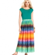 A palette of vibrant, eye-catching colors brightens up Vince Camuto's floaty maxi skirt. A solid top and strappy flat sandals showcase the vivid ombre effect.