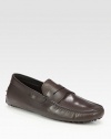 An easy-going moccasin style is crafted with great detail in fine leather. Leather lining Driver sole Made in Italy 