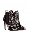 Glam up your cocktail-ready look with these incredibly luxe Emilio Pucci pony hair ankle boots featuring a bold animal print - Pointed toe, seaming details, elasticized side panels, stiletto heel, pull-on style - Wear with a pencil skirt and a fitted blouse or a flirty frock