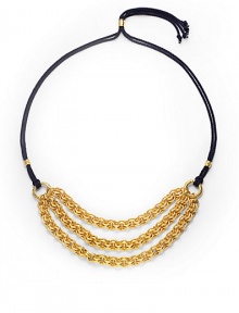 THE LOOKThree bold, graduated golden chainsDouble strands of braided navy cordSliding, adjustable lariat-style bead closeTHE FITChain length, about 9Overall length, about 42THE MATERIALRayon cord24k gold platingORIGINMade in USA