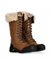 Brave the elements in style this season with UGG Australias ultra warm Adirondack tall lace-up boots, finished with waterproof full grain leather and sheepskin lining for an ultra luxe edge - Rounded toe, leather and suede upper, canvas lace-up front, thick rubber lug sole - Hits below the knee - Pair with sporty outerwear and fun, bright knitwear