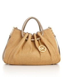 18K gold hardware and glossy leather ring handles add luxe appeal to this on-trend straw tote from MICHAEL Michael Kors.