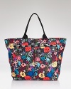 Tote something with a deluxe attitude. LeSportsac's print-splashed bag is a standout option for the every-girl with a taste for the garden variety.