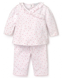 Rendered in heart print Pima cotton, this pink and white Kissy Kissy set features a ruffle trim top and basic pants.