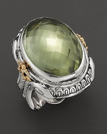 Sterling silver, touched with 14K yellow gold and detailed with a mythological motif, houses a dramatic, faceted green amethyst.