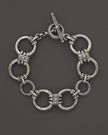 Circular links in hammered sterling silver from Konstantino.