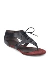 THE LOOKThong sandal Oxford-style lace-up frontTHE FITStacked wedge heel, ½ (15mm)THE MATERIALLeather upper Leather lining and sole Padded insoleORIGINImportedOUR FIT MODEL RECOMMENDS ordering one half size up as this style runs small. 