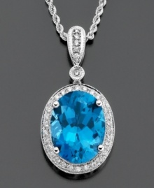 Accessorize with a conversation piece. This eye-catching pendant features gleaming oval-cut blue topaz (11-1/4 ct. t.w.) and round-cut diamond (1/3 ct. t.w.) set in 14k white gold. Approximate length: 18 inches. Approximate drop: 1-1/4 inches.