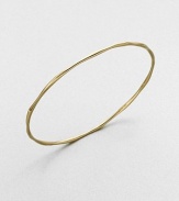 Proof that simple can be sensational, this slender gold bangle undulates elegantly.18k yellow goldDiameter, about 2.6Imported