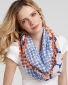 A charming circle scarf with two different patterns and contrast pom-pon edges.