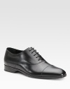 An elegant dress standard features a cap toe and beveled outsole with signature initial detail. Leather lining Padded insole Rubber sole Made in Italy 