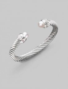 From the Silver Ice Collection. A signature Yurman cable of sterling silver, richly enhanced by bands of pavé diamonds encircling lustrous white freshwater pearl end caps. Diamonds, 0.48 tcw White freshwater pearls Sterling silver Cable, 7mm Diameter, about 2¼ Made in USA