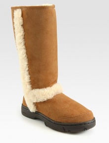 This suede style looks and feels comfortable with shearling lining, padded insole and outside trim. Heel, 1 (25mm) Shaft, 11 Leg circumference, 14 Logo at heel Shearling lining and padded insole Rubber sole ImportedOUR FIT MODEL RECOMMENDS ordering true whole size; ½ sizes should order the next whole size down.