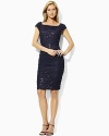 Finished with a boat neckline and shirring down the sides for a flattering, body-contouring fit, a bold sequined dress with a mesh overlay exudes chic, sexy appeal.