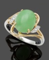 Bold color combines with stately elegance. This unique ring highlights an oval-shaped jade stone (8 mm x 10 mm) with sparkling diamond accents. Crafted in 14k gold and sterling silver. Size 7.