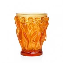 In 1927, René Laliques imagination and genius led to the creation of the Bacchantes vase. And to honor its 80th anniversary, the Bacchantes vase is being released in amber crystal for the first time. Each piece is numbered.