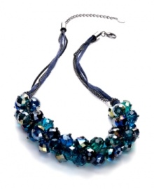 Heeding the call of the wild. The Peacock cluster necklace from c.A.K.e. by Ali Khan is crafted from silver tone mixed metal and suede with faceted glass beads in teal, turquoise, green and blue for a fashion-forward look. Approximate length: 18 inches + 3-inch extender.