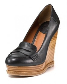 Classic penny loafers grow up with a boost from stacked wooden wedges for A+ style. By Lucky Brand.