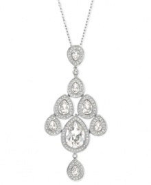 With an elegant, fluid silhouette, Swarovski's enchanting pendant features pear-shaped clear crystals which can move freely, much like a chandelier. A touch of clear crystal pavé adds extra sparkle. The pendant comes on a rhodium-plated chain and is perfect for an evening out! Approximate length: 15-7/10 inches + 1-2/5-inch extender. Approximate drop: 2-4/5 inches.