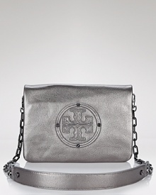 Give into logo lust with Tory Burch's embossed leather clutch. In a cool metallic hue, this convertible style slings over your shoulder for an uptick in after-hours smolder.