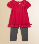 Sweet bows, sequins and ruffles adorn this adorable sweater tunic and leggings set.  Tunic Ribbed roundneckShort puff sleevesBow and sequin accentsRuffled hemBack keyhole with button closure Leggings Elastic waistbandPull-on styleTunic: cotton/acrylicLeggings: cotton/spandexMachine washImported