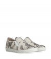 Inject effortless edge into every outfit with McQ Alexander McQueens printed canvas slip-ons, a uniquely cool choice for dressing up or down - Round toe, black printed cream canvas uppers, logo on outside of heel, white elastic inserts and trim, white rubber sole, slips on - Wear with slim fit trousers, a graphic tee and hoodie, or as a sartorial finish to summer suits