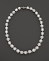 Cultured South Sea pearls in soft white join at a 14K white gold clasp.