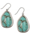 Turquoise treat. Lucky Brand pays homage to Southwestern chic with these stunning silver tone drop earrings, accented by a semi-precious turquoise stone. Pair them with faded denim or flirty summer dresses. Approximate drop: 1-1/4 inches.