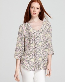 Fresh pleats trim the front placket of this new Yumi Kim top, flaunting black buttons at the bodice and cuffs. The creamy color palette pairs elegantly with white jeans for sophisticated weekends.