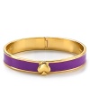 A sweetly simple 12-karat gold plated bracelet gets a lesson in bold style from kate spade new york. This bangle flaunts the brand's signature motif, with a cool touch of color.