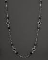 Faceted black onyx blooms along an intricate sterling silver chain. By Konstantino.