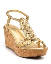 In gleaming gold, the braided Becca T-strap wedges are toned down with a cork wedge. From kate spade new york.