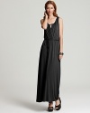 A dramatic floor-sweeping silhouette and an edgy crossed front detail lend understated glamour to this Three Dots maxi dress.