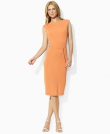 Classic lines define a sleek petite jersey dress from Lauren by Ralph Lauren, tailored in a sleeveless silhouette with a chic boatneck and slender ties at the waist. (Clearance)