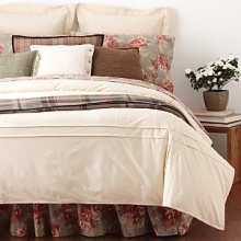 A rich plaid pattern and soft velvet binding infuse this sham with heritage inspiration and luxurious texture.